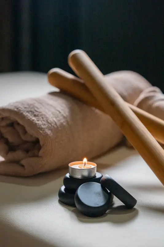 Rolled towel and candle
