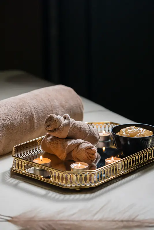 Gold tray with towels and candles