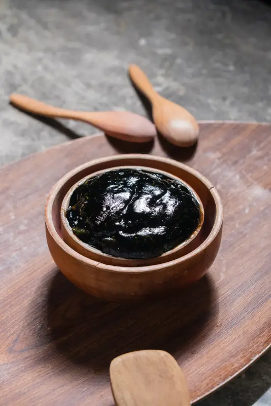 Black soap in wooden bowl