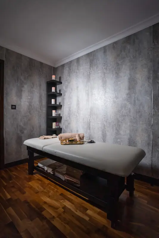 Massage bed in a stone room
